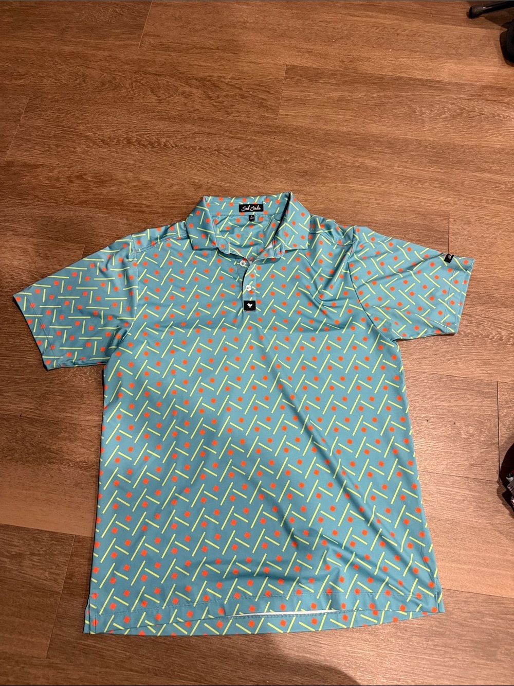 Bad Birdie Aqua Geometric Polo with Orange Accents